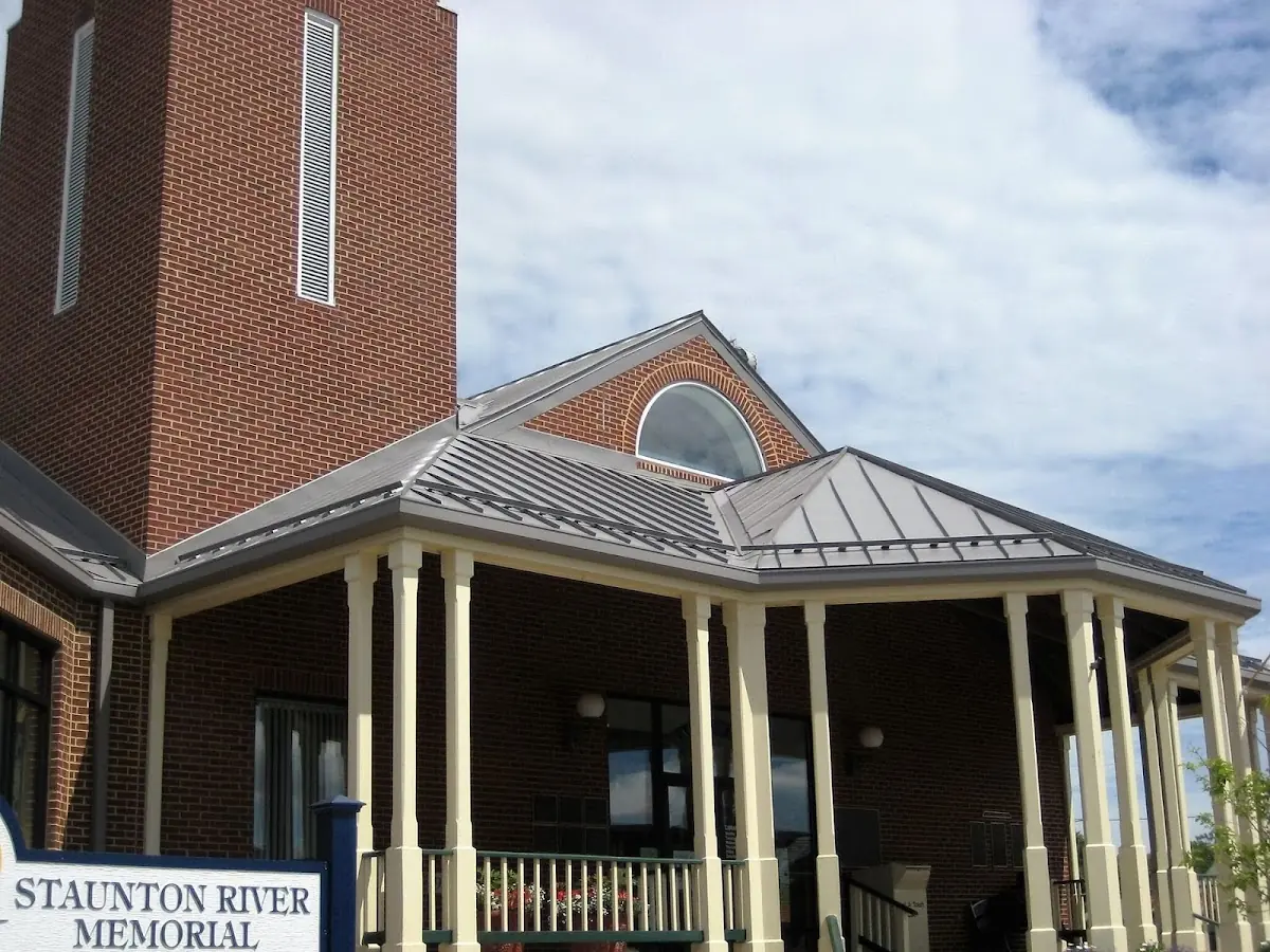 Skilled roofing craftsmen working on a residential roof in Seymour Johnson Homes